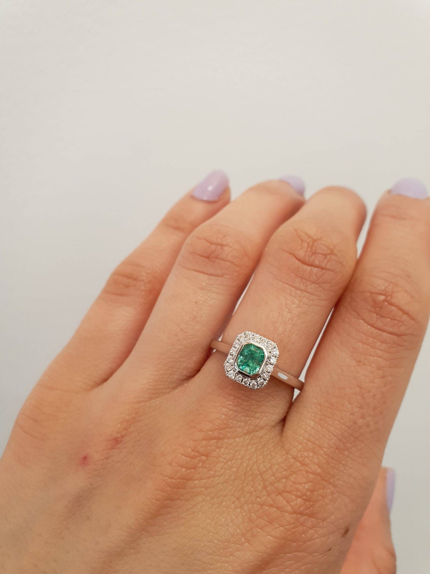 Platinum Emerald Ring with Diamond Halo