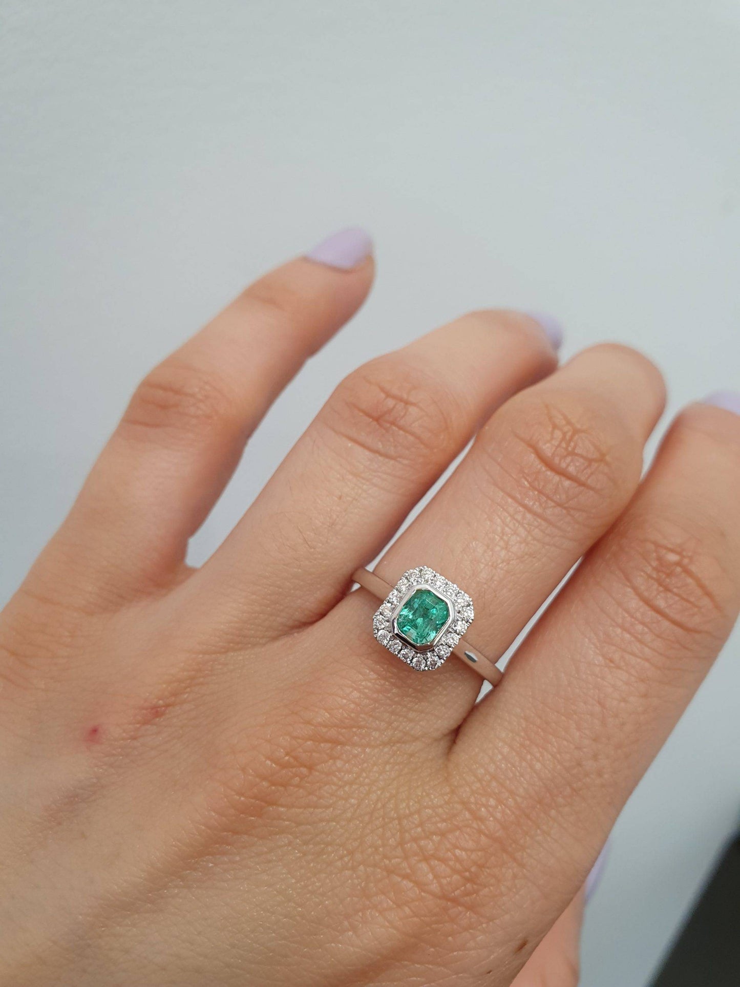 Platinum Emerald Ring with Diamond Halo
