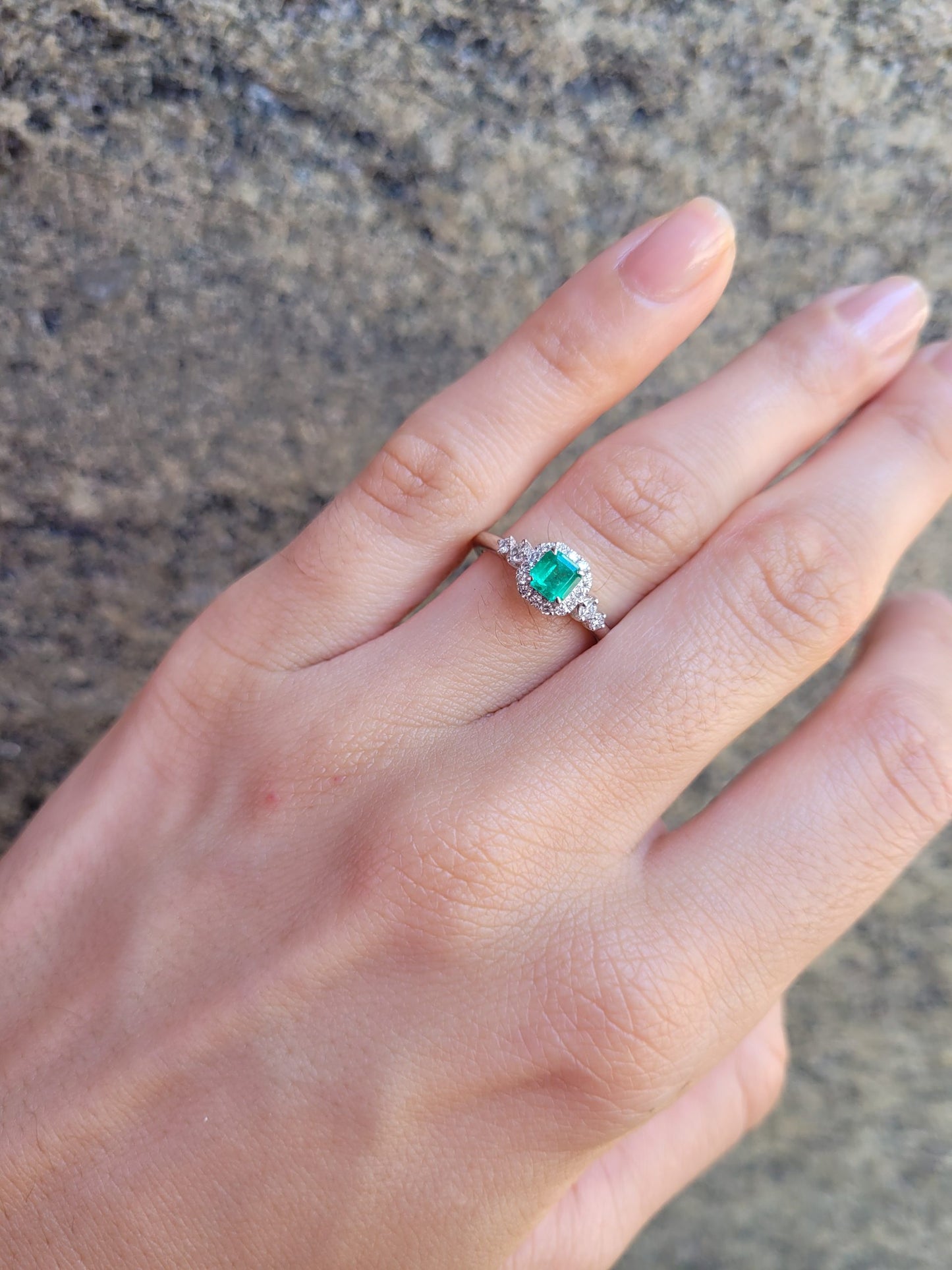 Platinum Ring with Emerald Cut Colombian Emerald and Diamond Halo