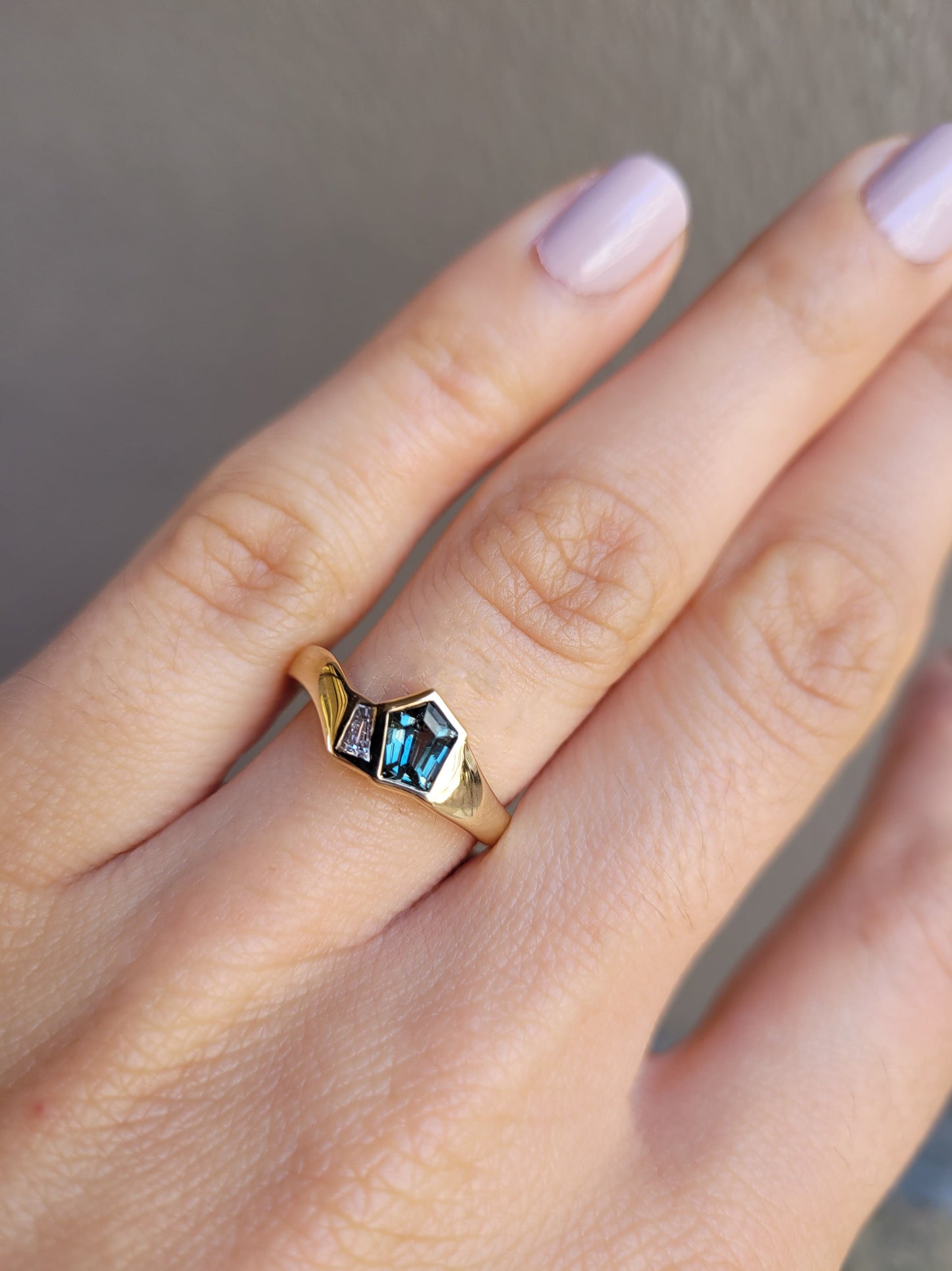 Gold ring with blue gemstones