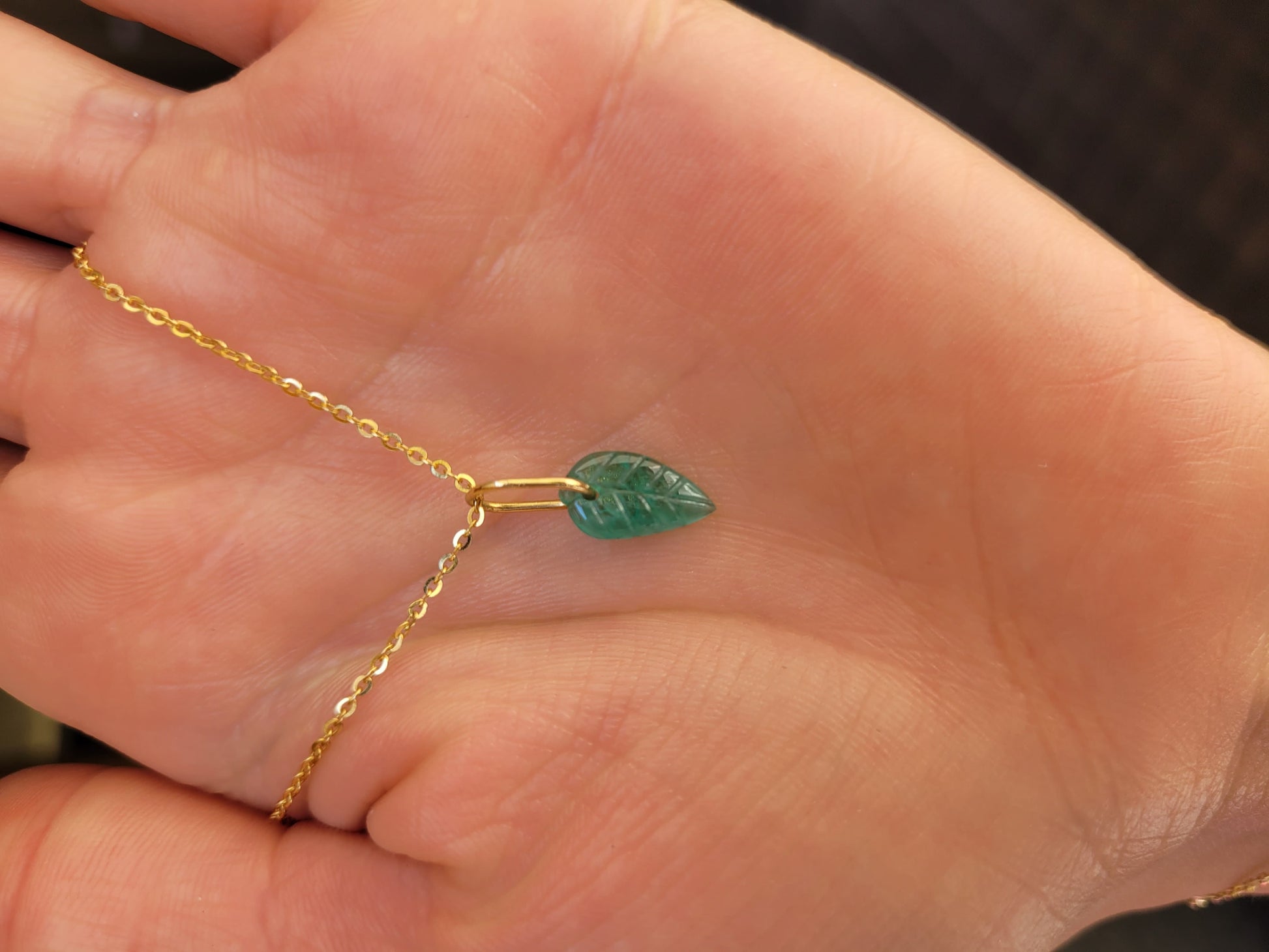 photo on hand of Colombian Emerald Leaf Pendant 