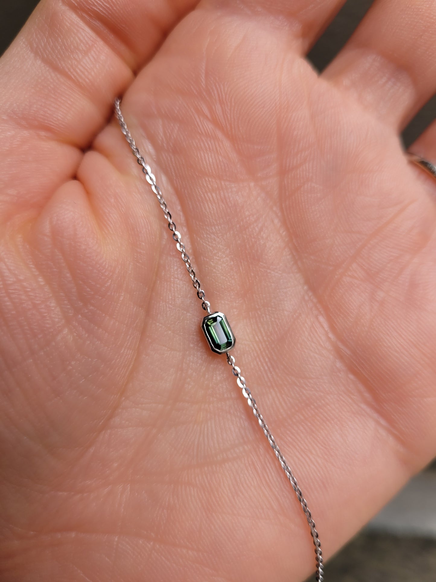 view against skin of Australian Teal Sapphire Bracelet in Platinum 