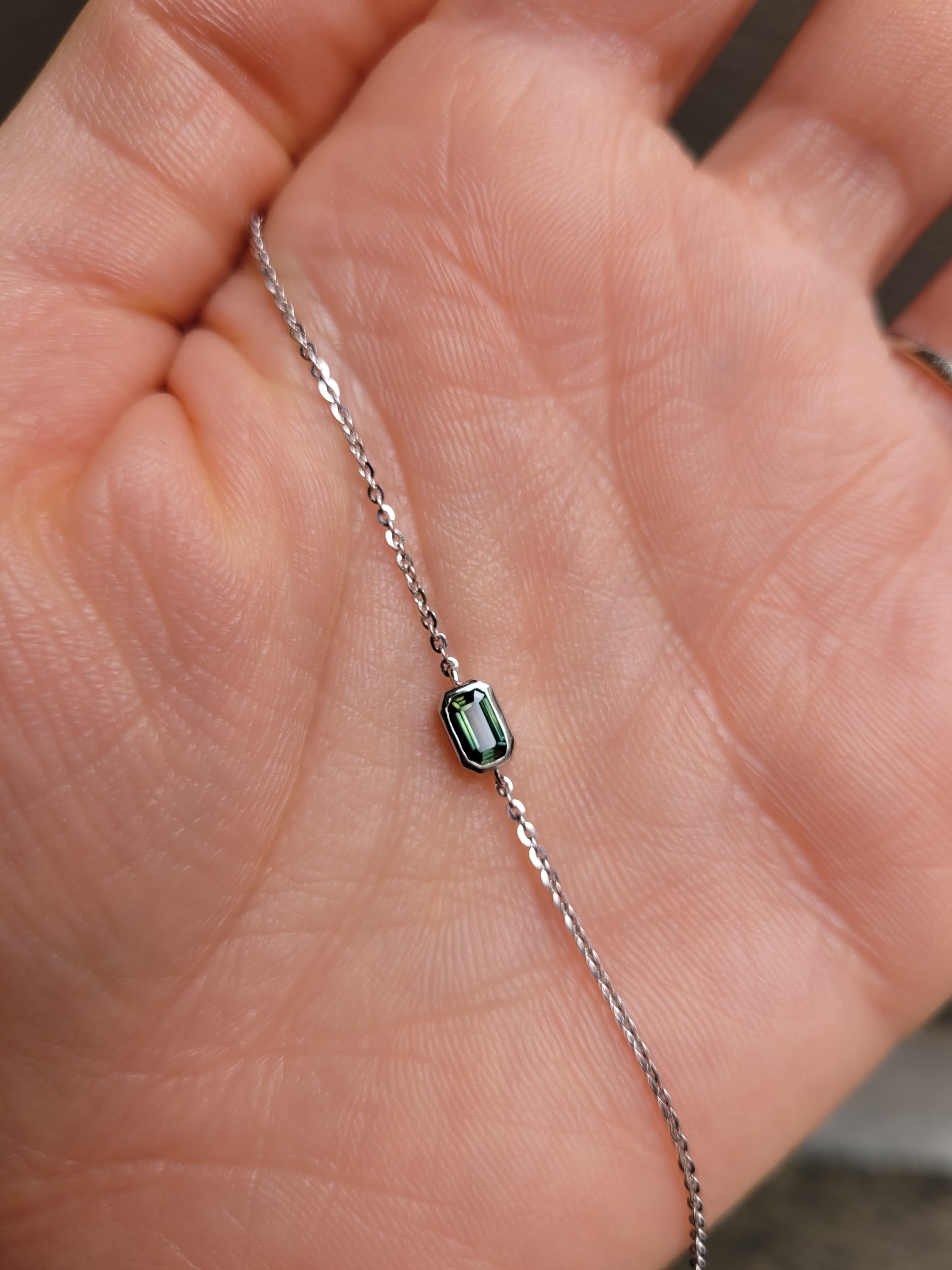 view against skin of Australian Teal Sapphire Bracelet in Platinum 