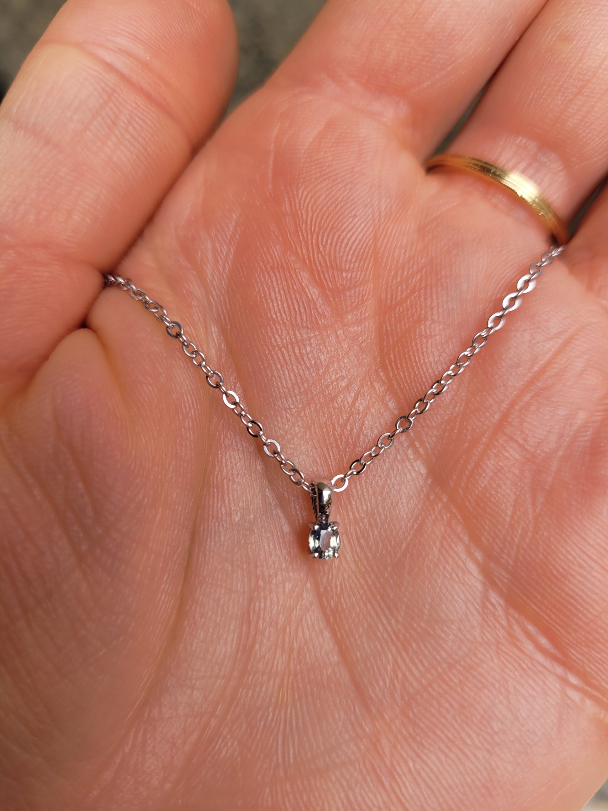 view of Alexandrite Pendant in Platinum 950 - 0.18ct Apple Green Hue on a hand