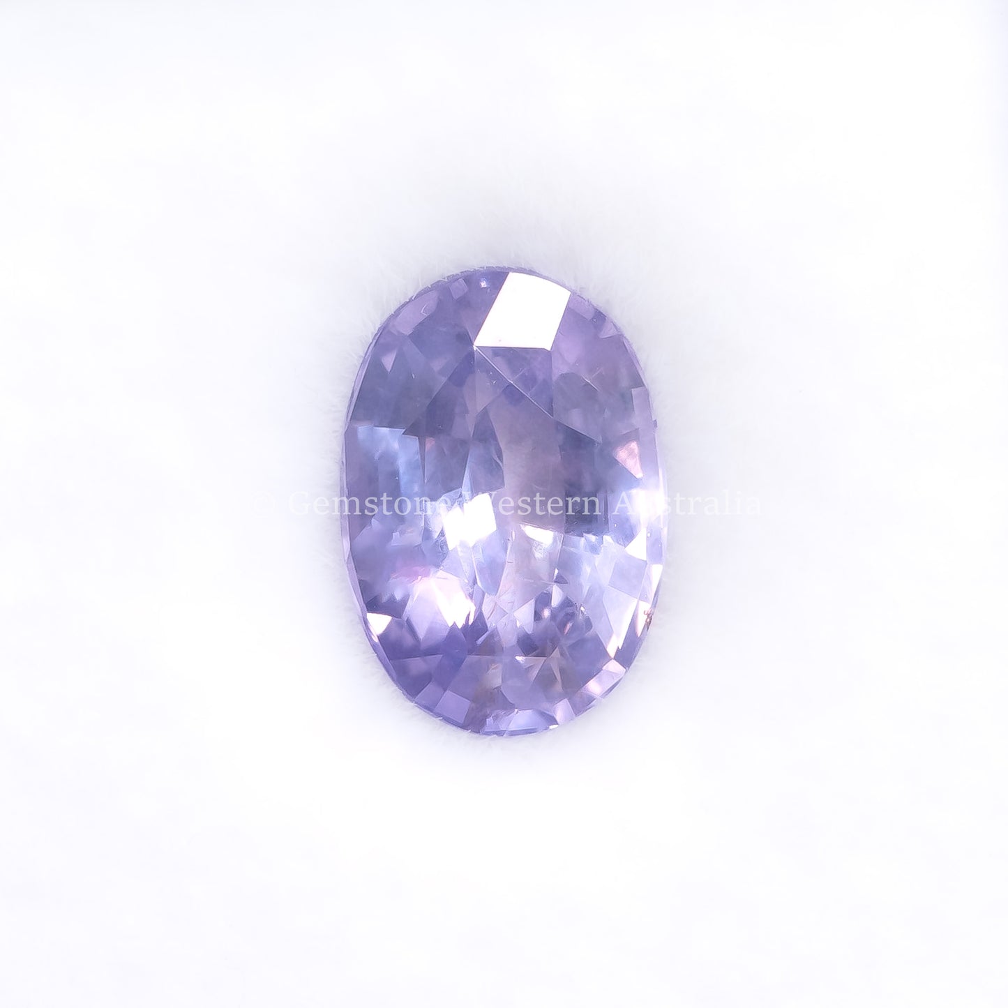 Front View of 1.72 Ct Natural Violet Sapphire Loose Gemstone Oval Cut in white background.