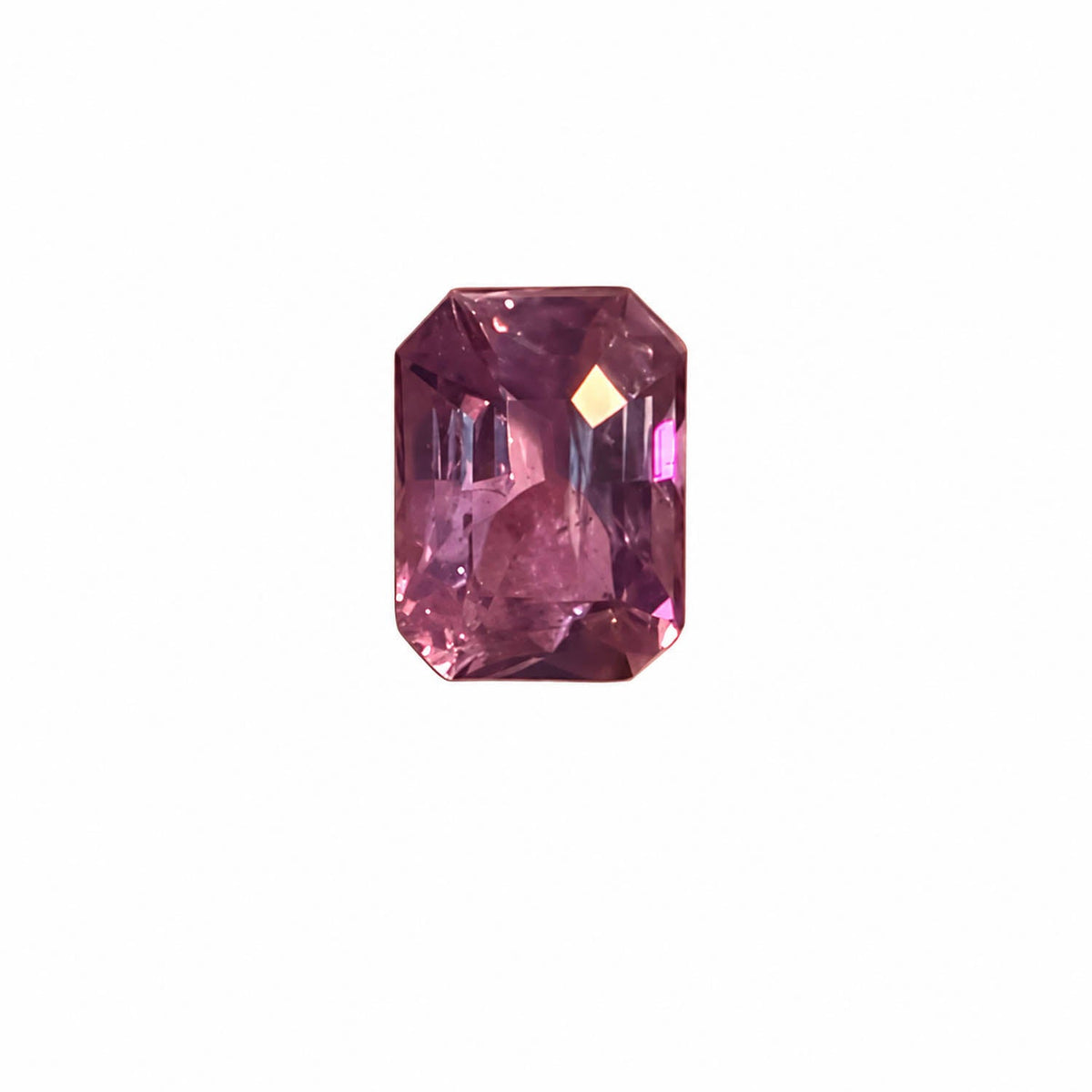 1.04 ct alexandrite under warm light showing its colour change