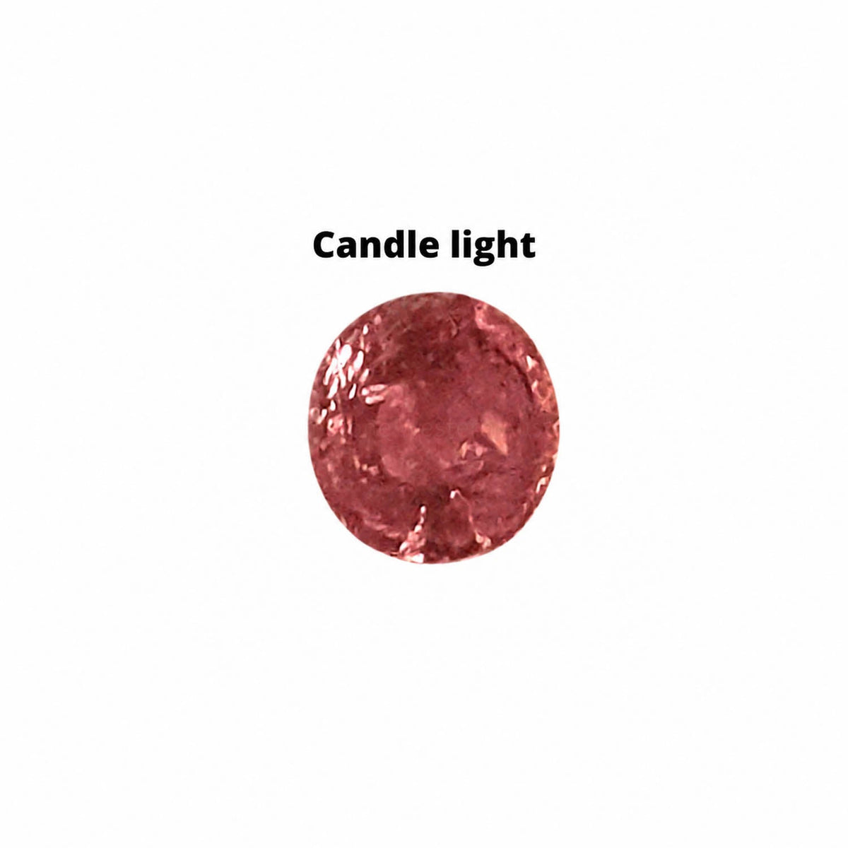 0.83 ct alexandrite under warm light showing its colour change