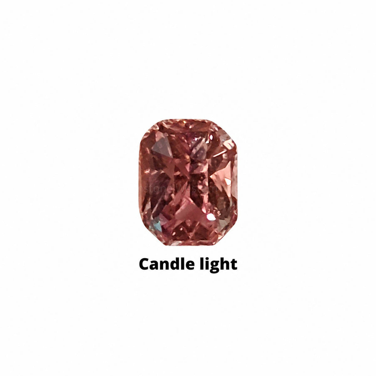 0.80 ct alexandrite under warm light showing its colour change