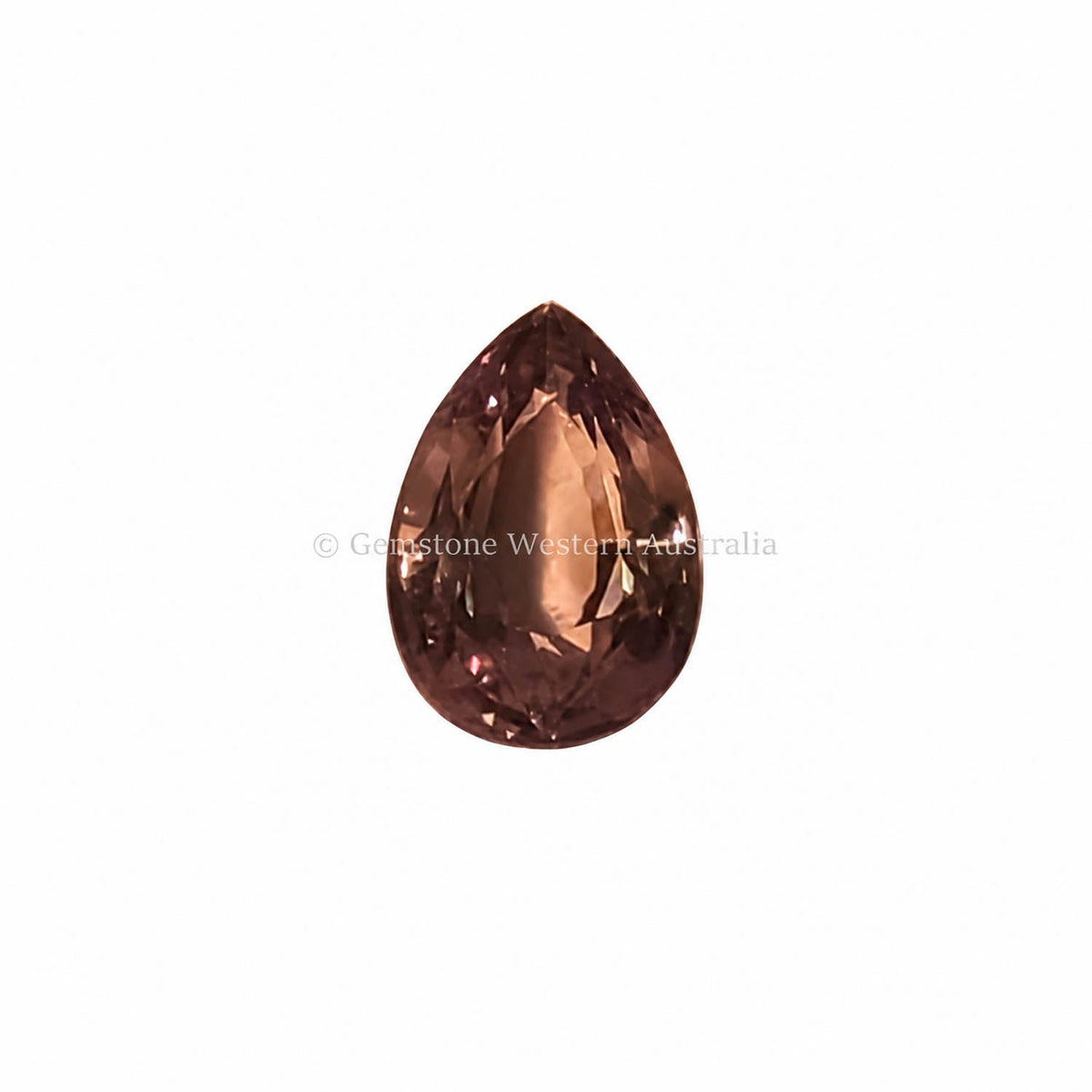 1.55 ct alexandrite under warm light showing its colour change