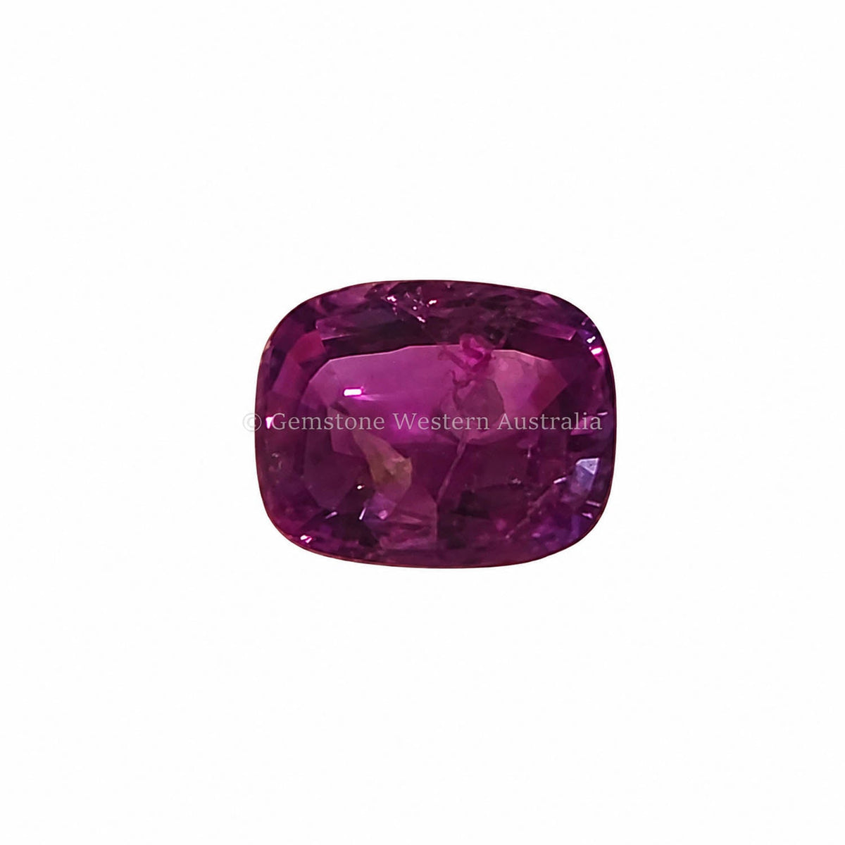 1.33 ct alexandrite under warm light showing its colour change