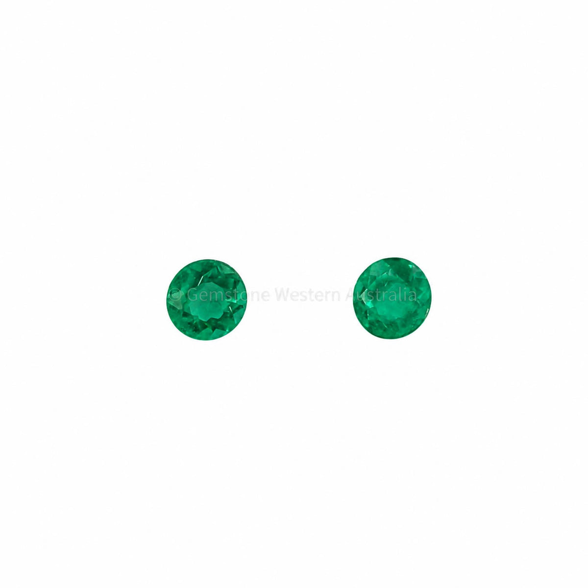 Matched pair of natural Colombian emeralds totalling 0.15 ct, round cut