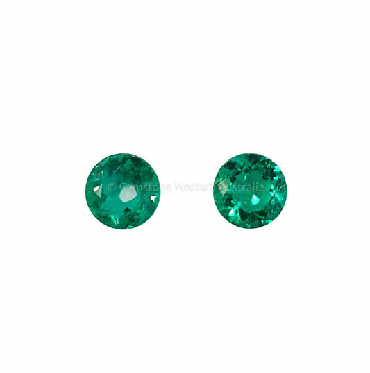Matched pair of natural Colombian emeralds totalling 0.34 ct, round cut