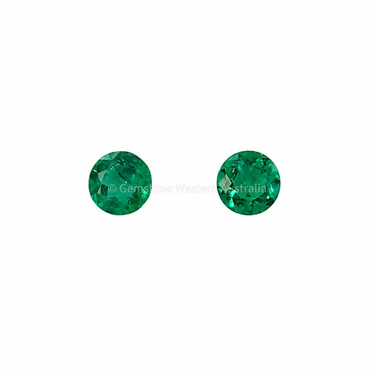 Matched pair of natural Colombian emeralds totalling 0.25 ct, round cut