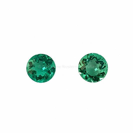 Matched pair of natural Colombian emeralds totalling 0.32 ct, round cut