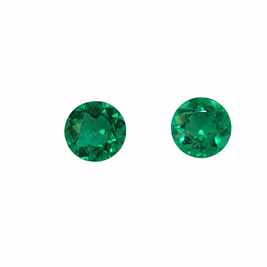 Matched pair of natural Colombian emeralds totalling 0.30 ct, round cut
