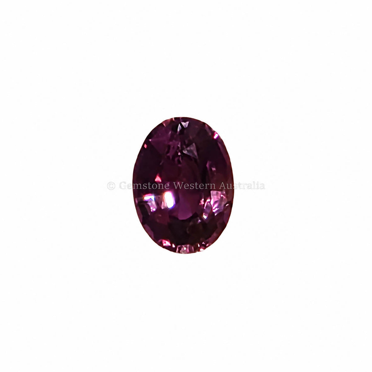0.63 ct alexandrite under warm light showing its colour change