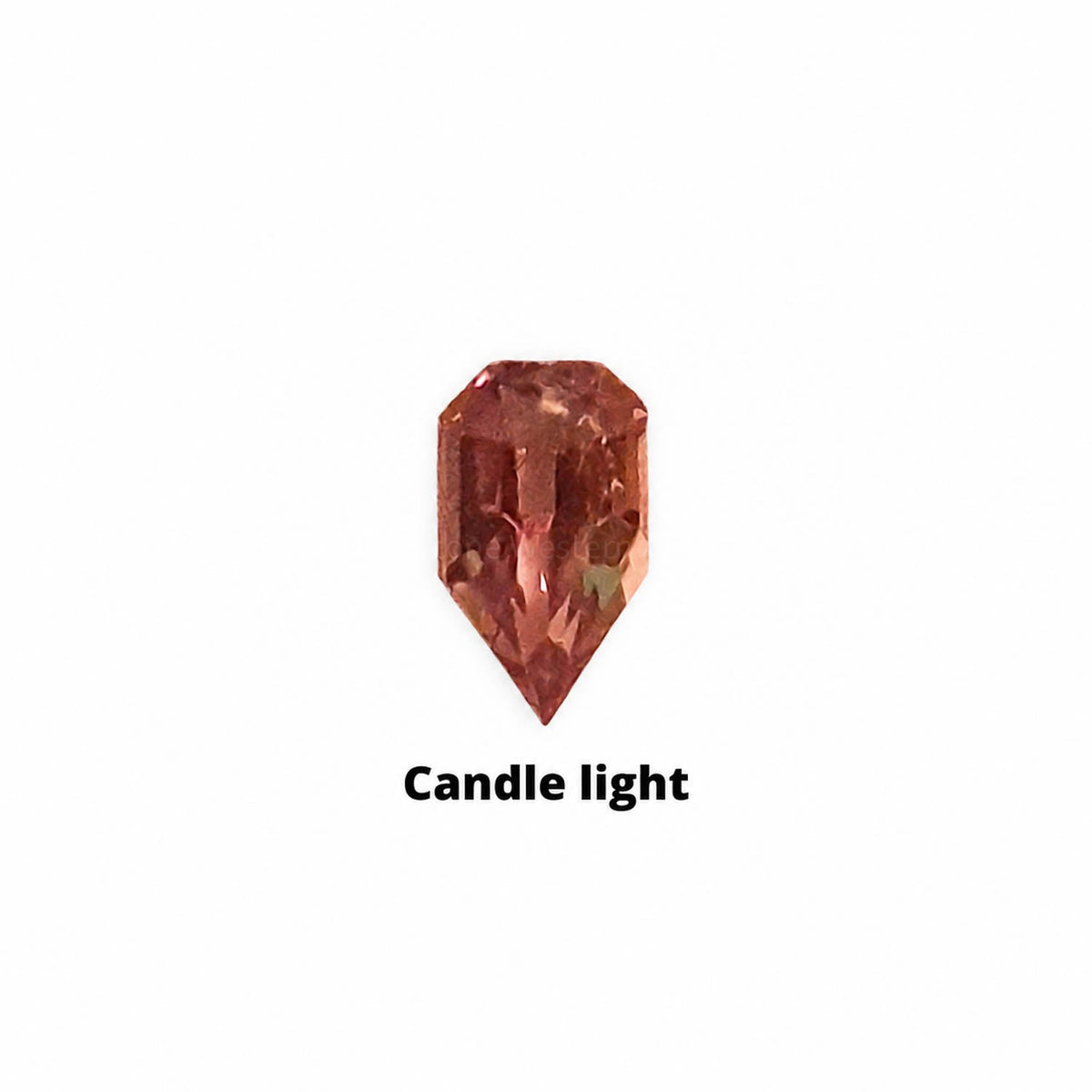 0.37 ct alexandrite under warm light showing its colour change