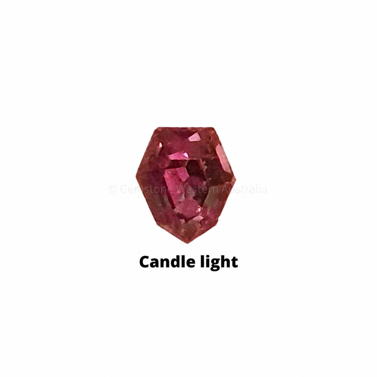 0.24 ct alexandrite under warm light showing its colour change