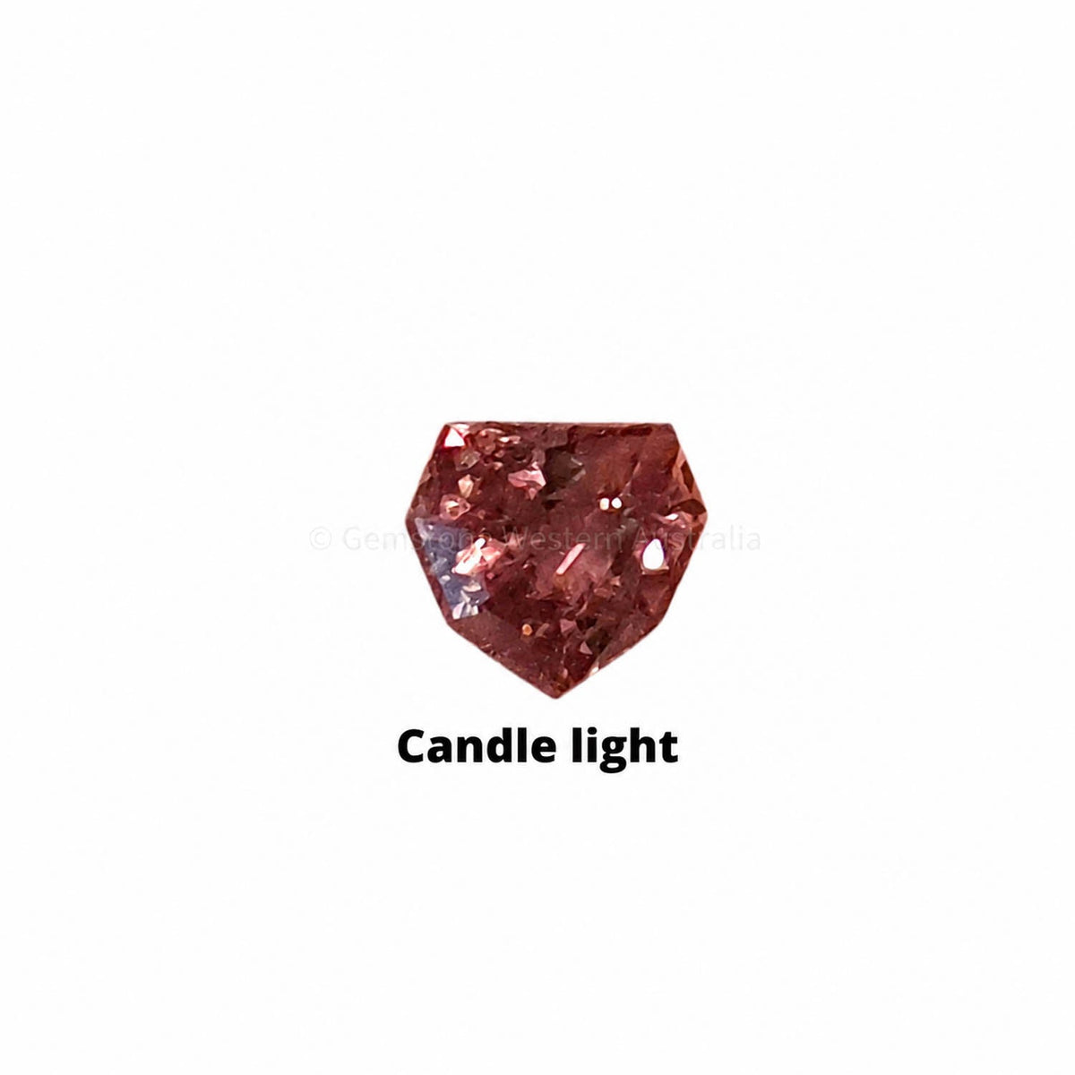 0.30 ct alexandrite under warm light showing its colour change