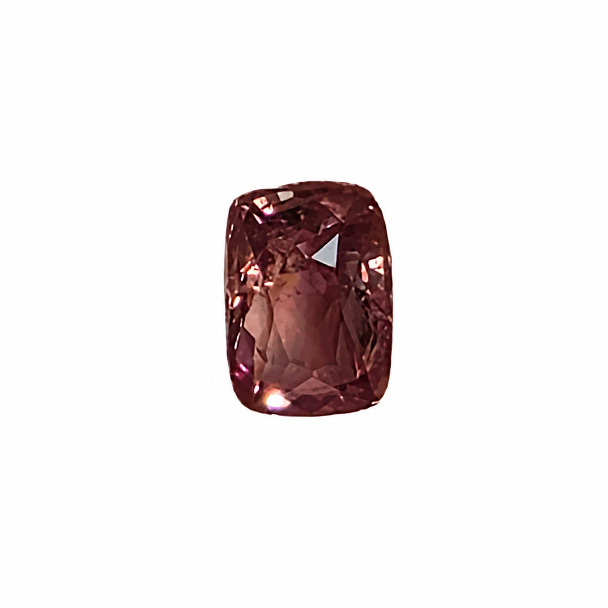 1.26 ct alexandrite under warm light showing its colour change