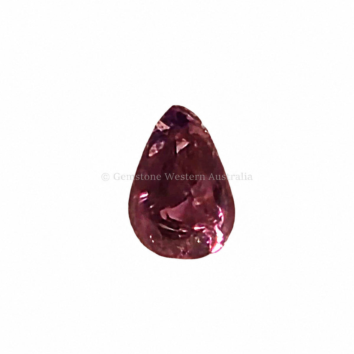 1.04 ct alexandrite under warm light showing its colour change