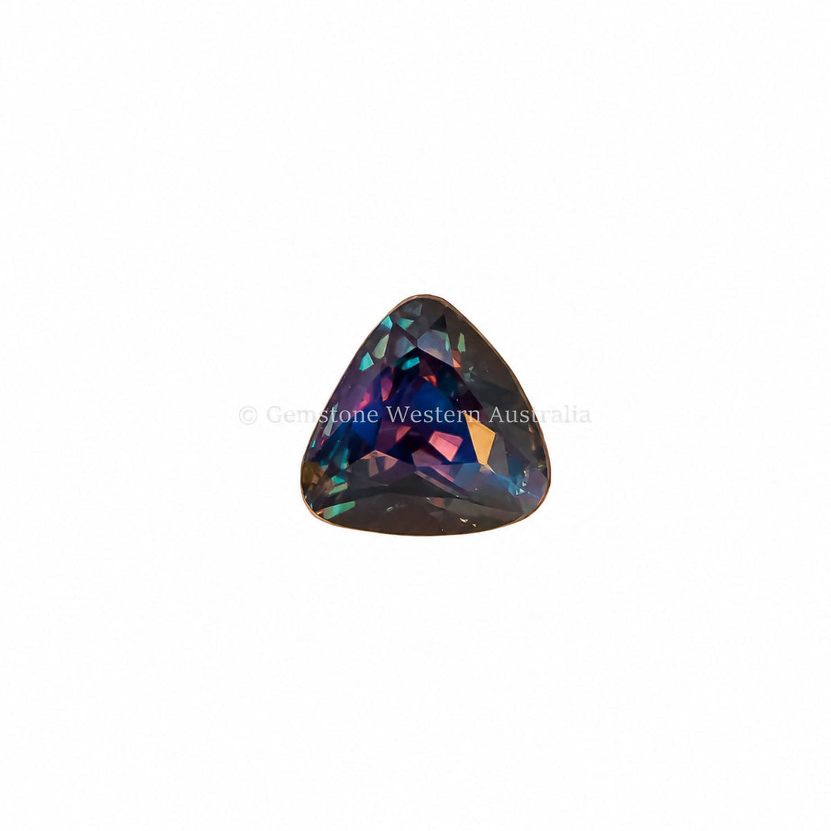 1.03 ct triangular cushion cut alexandrite photographed in daylight