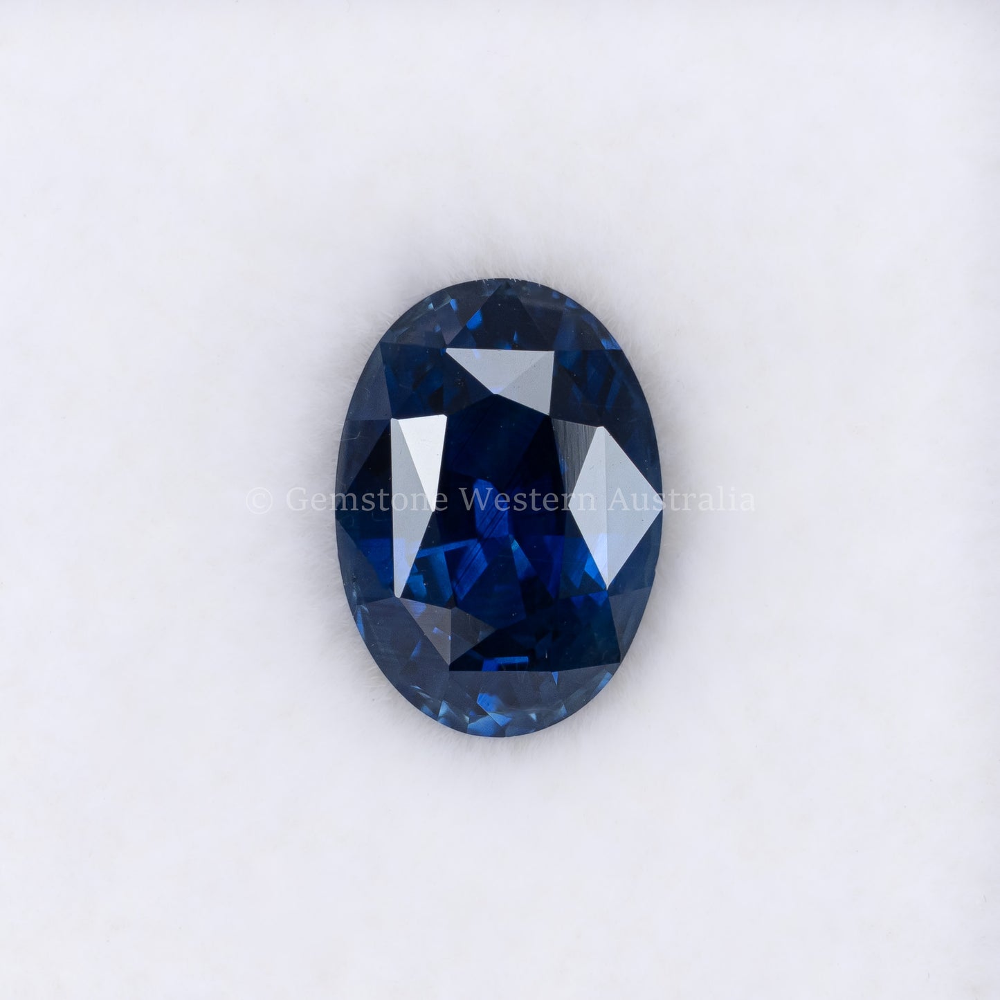 2.38CT NATURAL HEATED ROYAL BLUE SAPPHIRE - OVAL CUT IN WHITE BACKGROUND