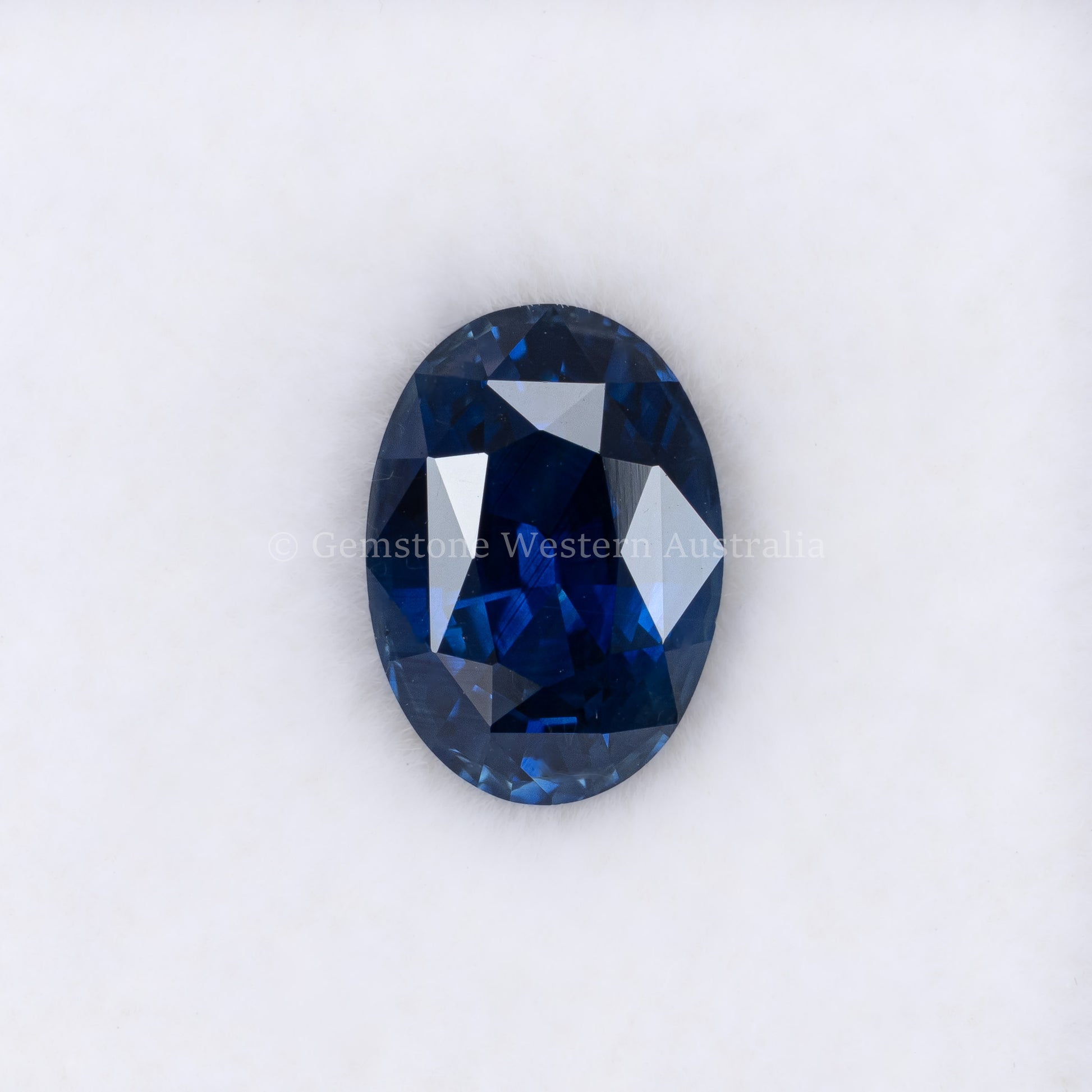 2.38CT NATURAL HEATED ROYAL BLUE SAPPHIRE - OVAL CUT IN WHITE BACKGROUND
