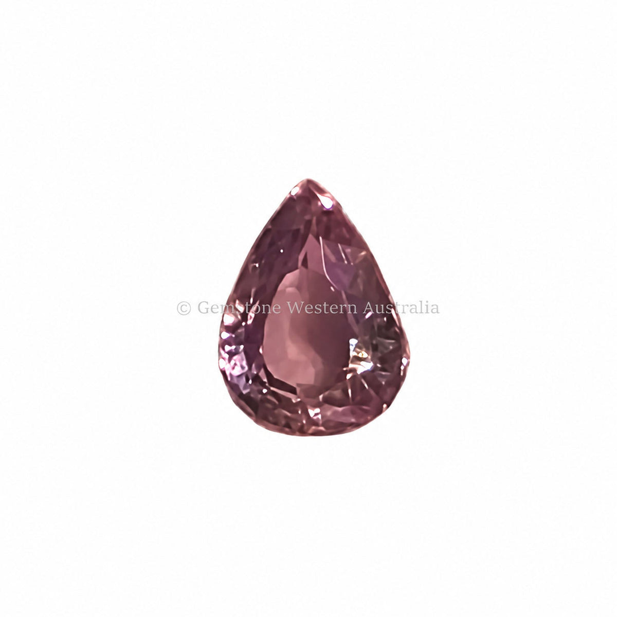 0.91 ct alexandrite under warm light showing its colour change