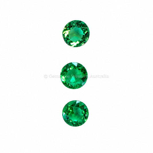 Set of three natural Colombian emeralds totalling 0.57 ct, round cut