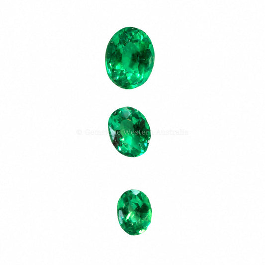 Set of three natural Colombian emeralds totalling 0.74 ct, oval cut