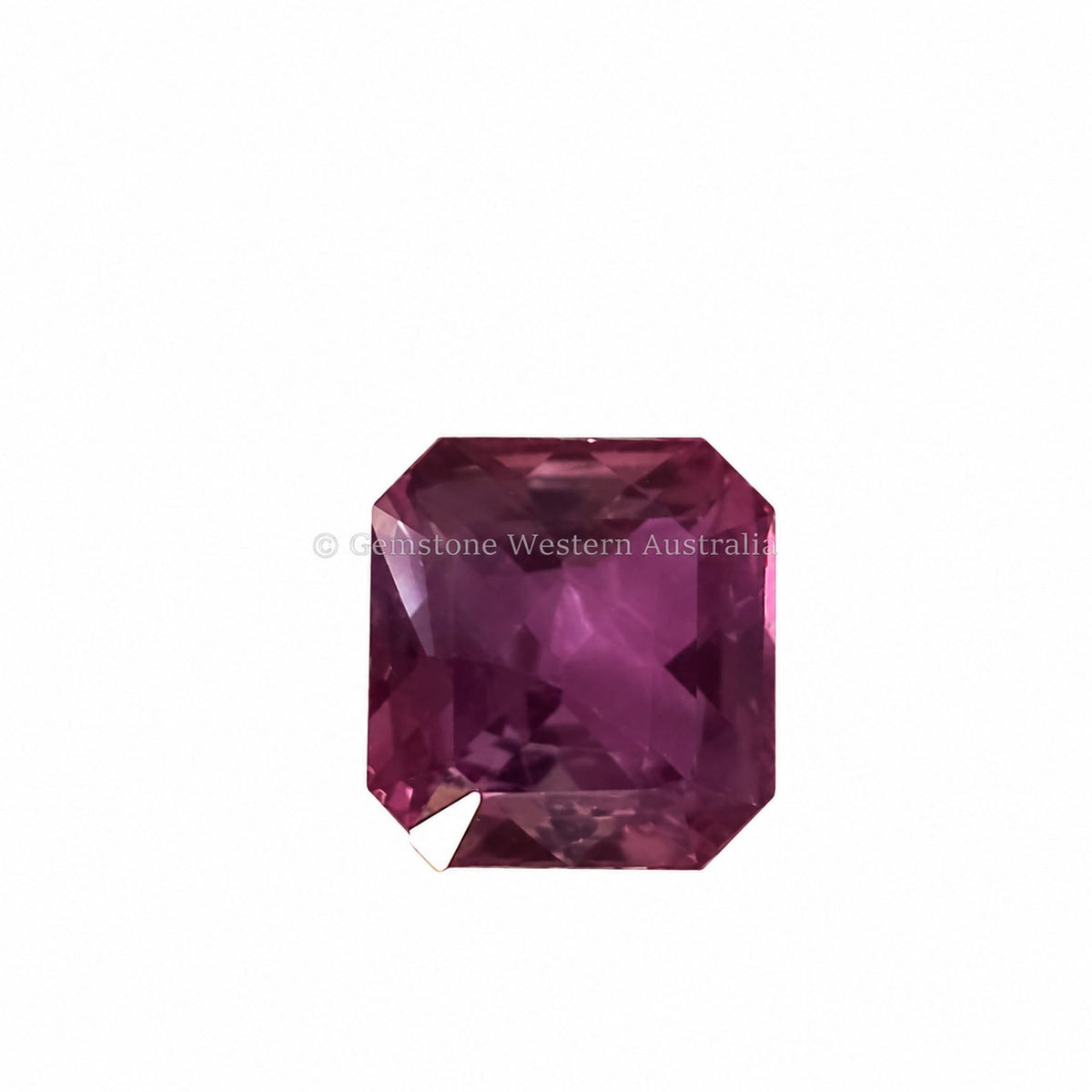 0.66 ct alexandrite under warm light showing its colour change