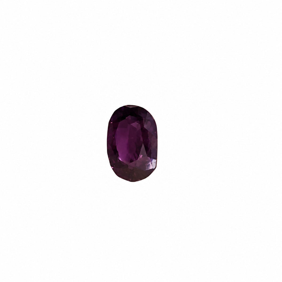 0.45 ct alexandrite under warm light showing its colour change
