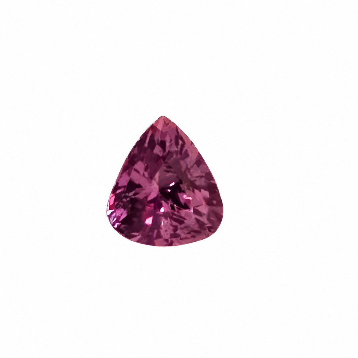 0.47 ct alexandrite under warm light showing its colour change