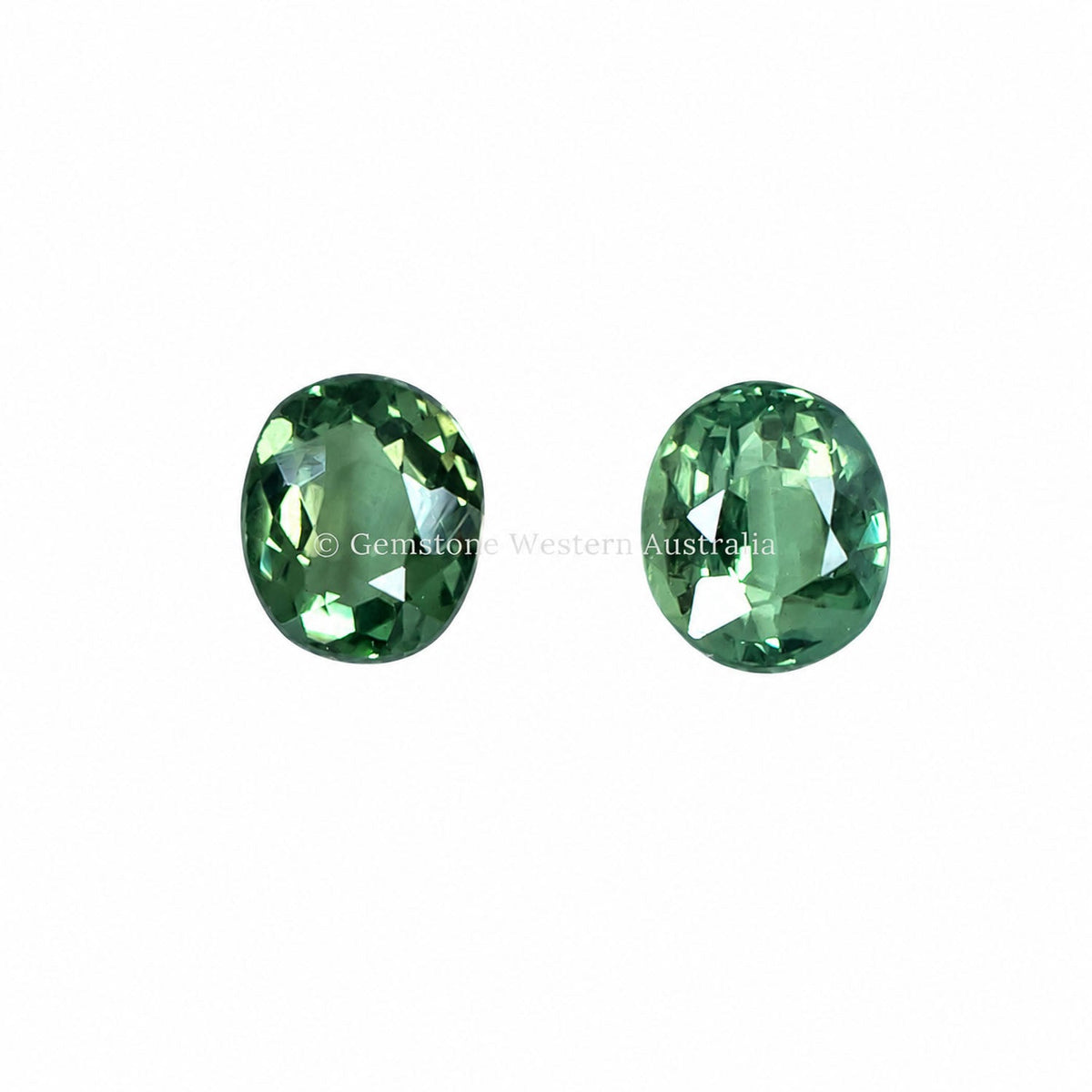 1.02 ct oval cut alexandrite pair photographed in daylight
