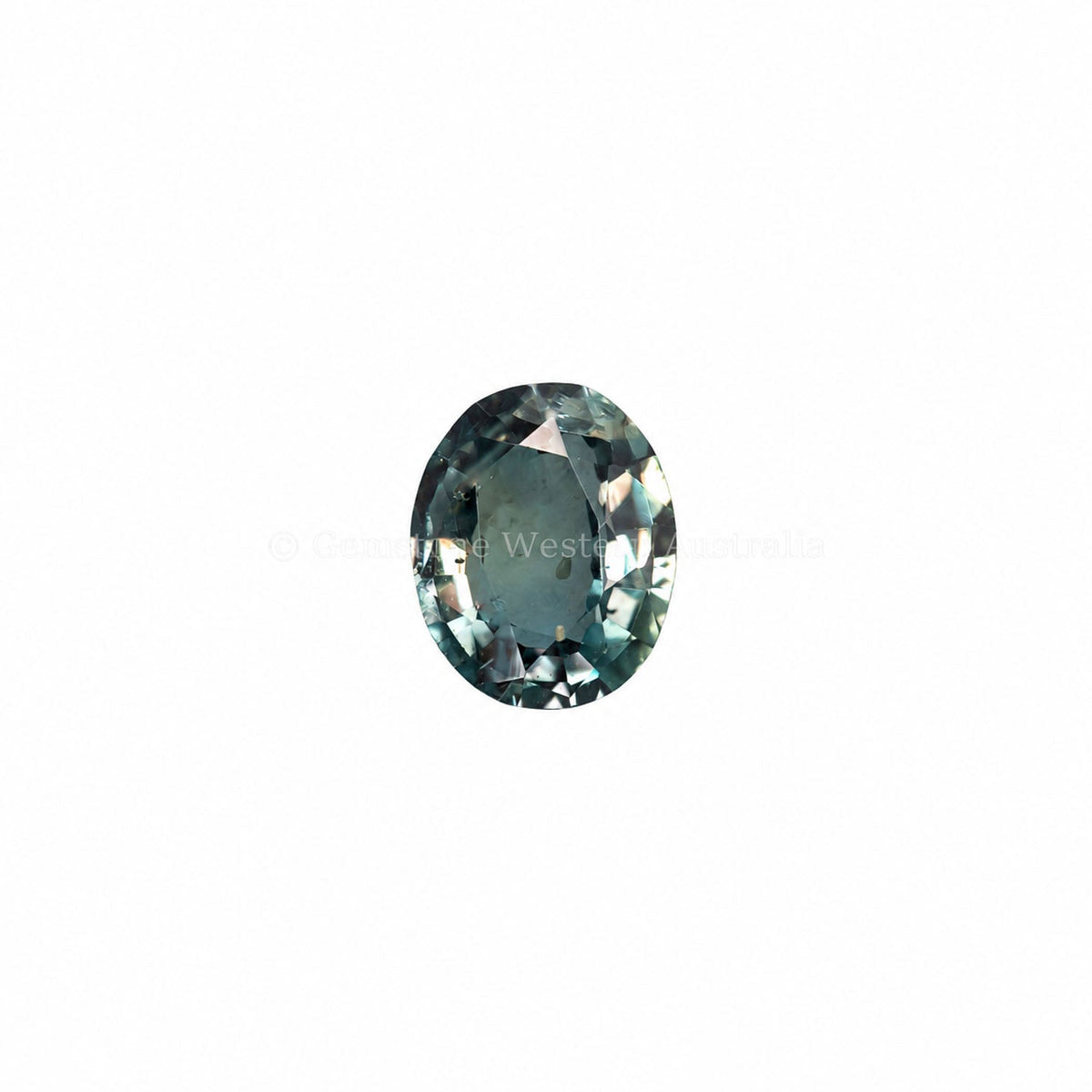 0.20 ct alexandrite under warm light showing its colour change