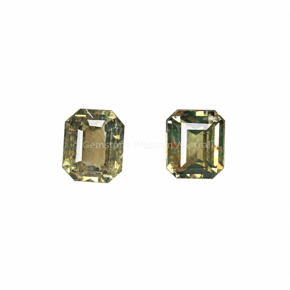 0.78 ct emerald cut alexandrite pair photographed in daylight