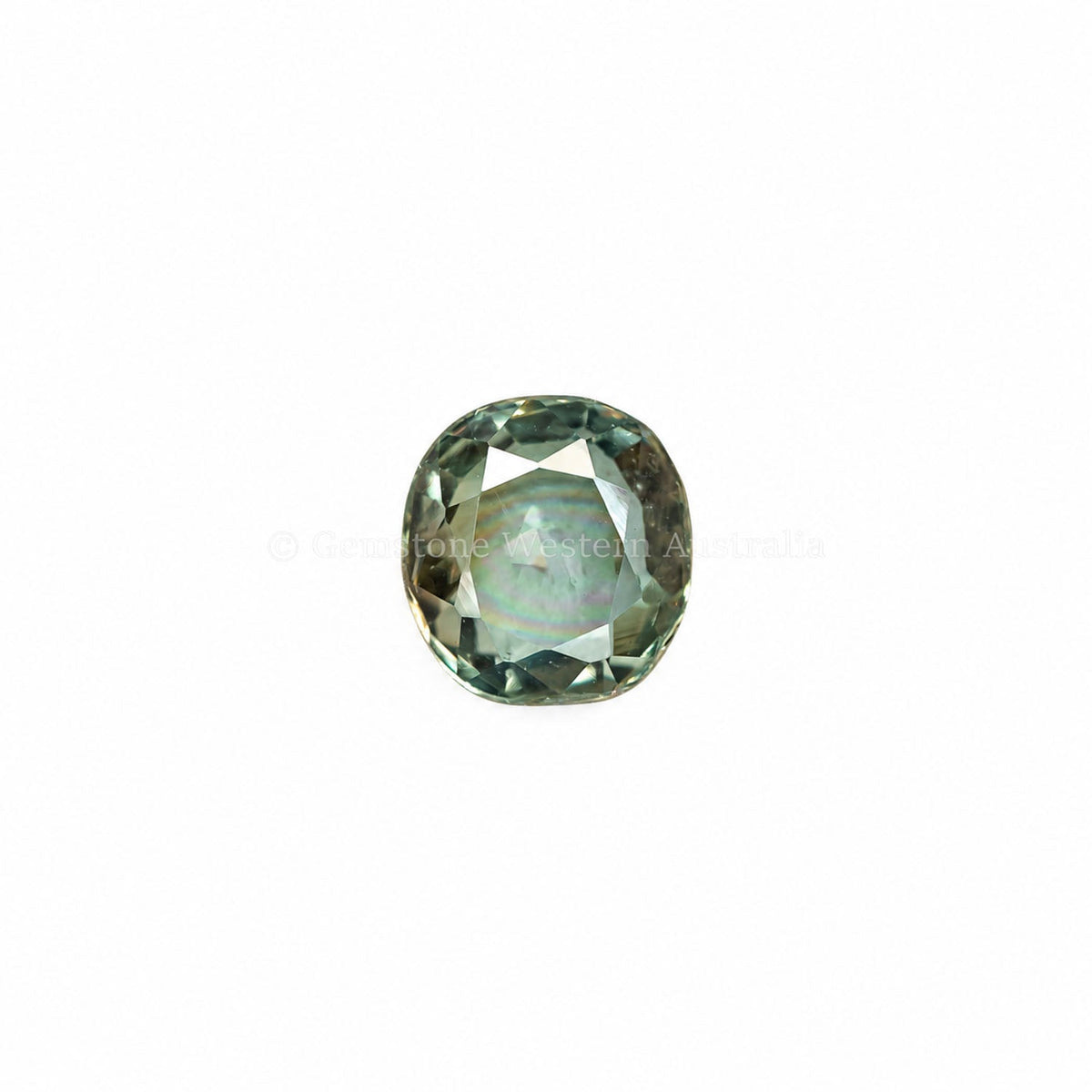 0.42 ct cushion cut alexandrite photographed in daylight