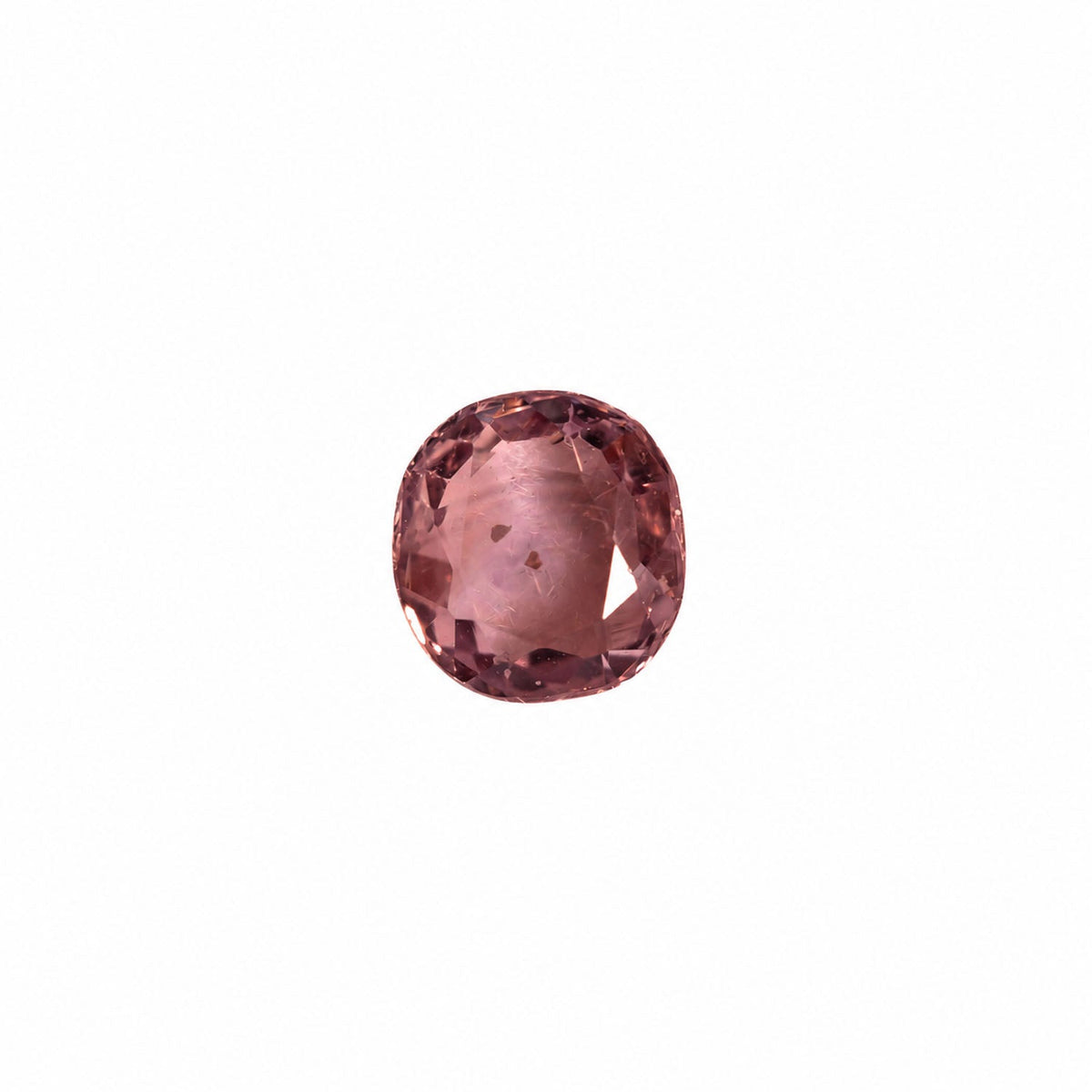 0.42 ct alexandrite under warm light showing its colour change
