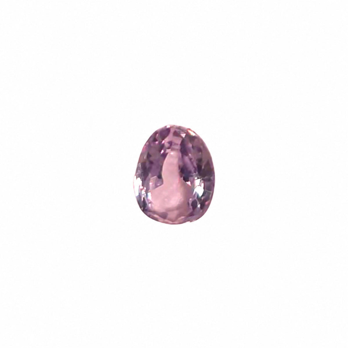 0.50 ct alexandrite under warm light showing its colour change