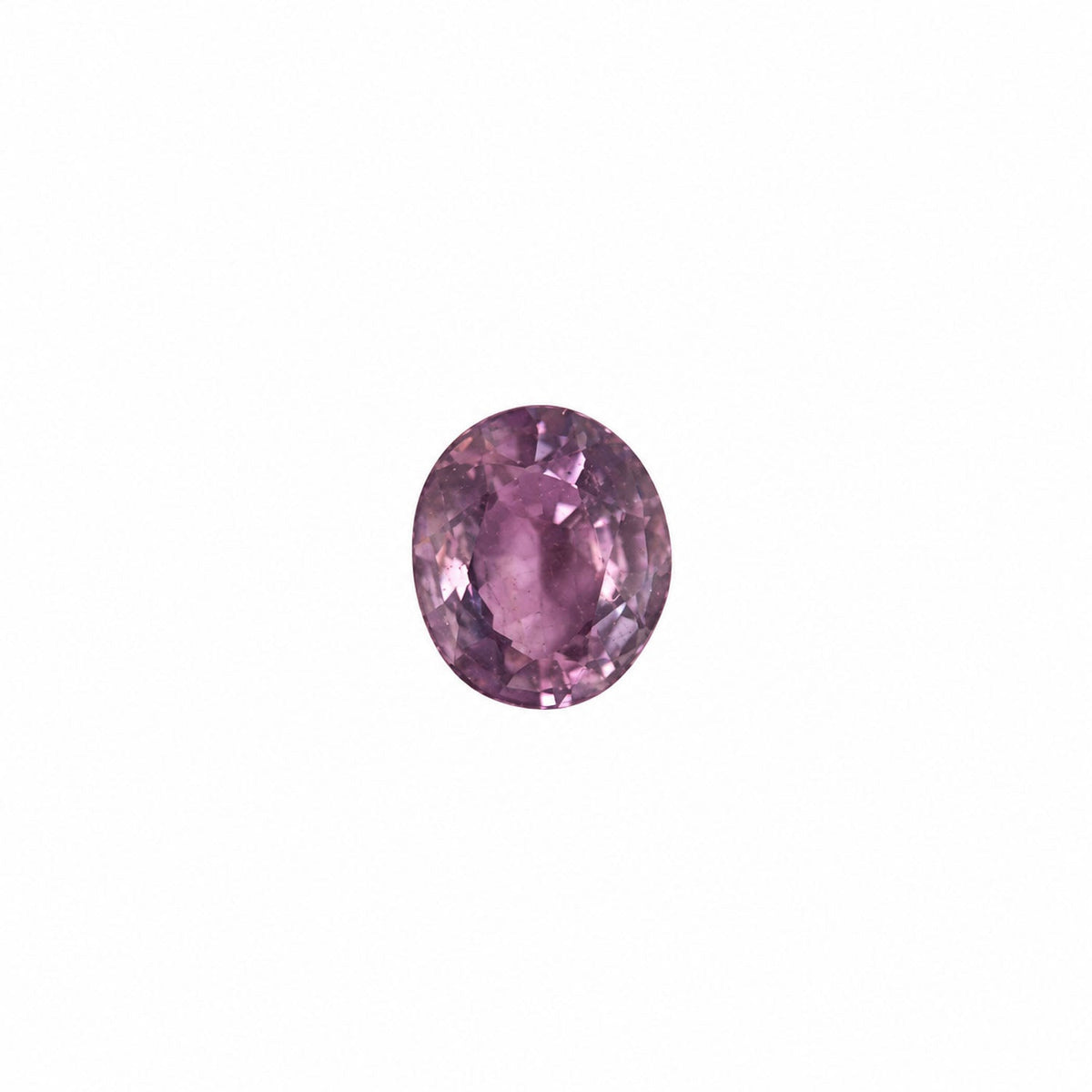 0.42 ct alexandrite under warm light showing its colour change