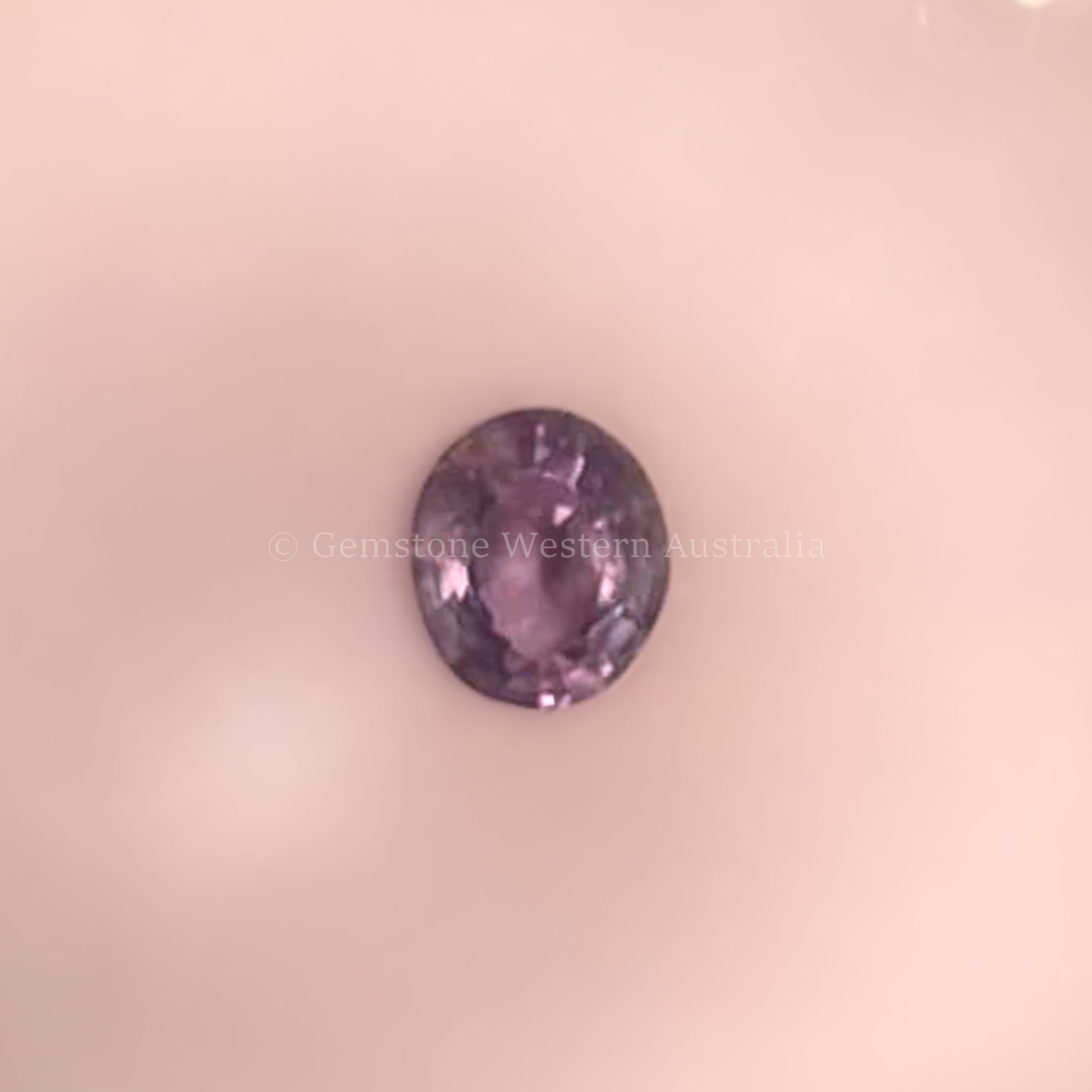 0.42 CT NATURAL ALEXANDRITE - OVAL CUT UNDER CANDLE LIGHT