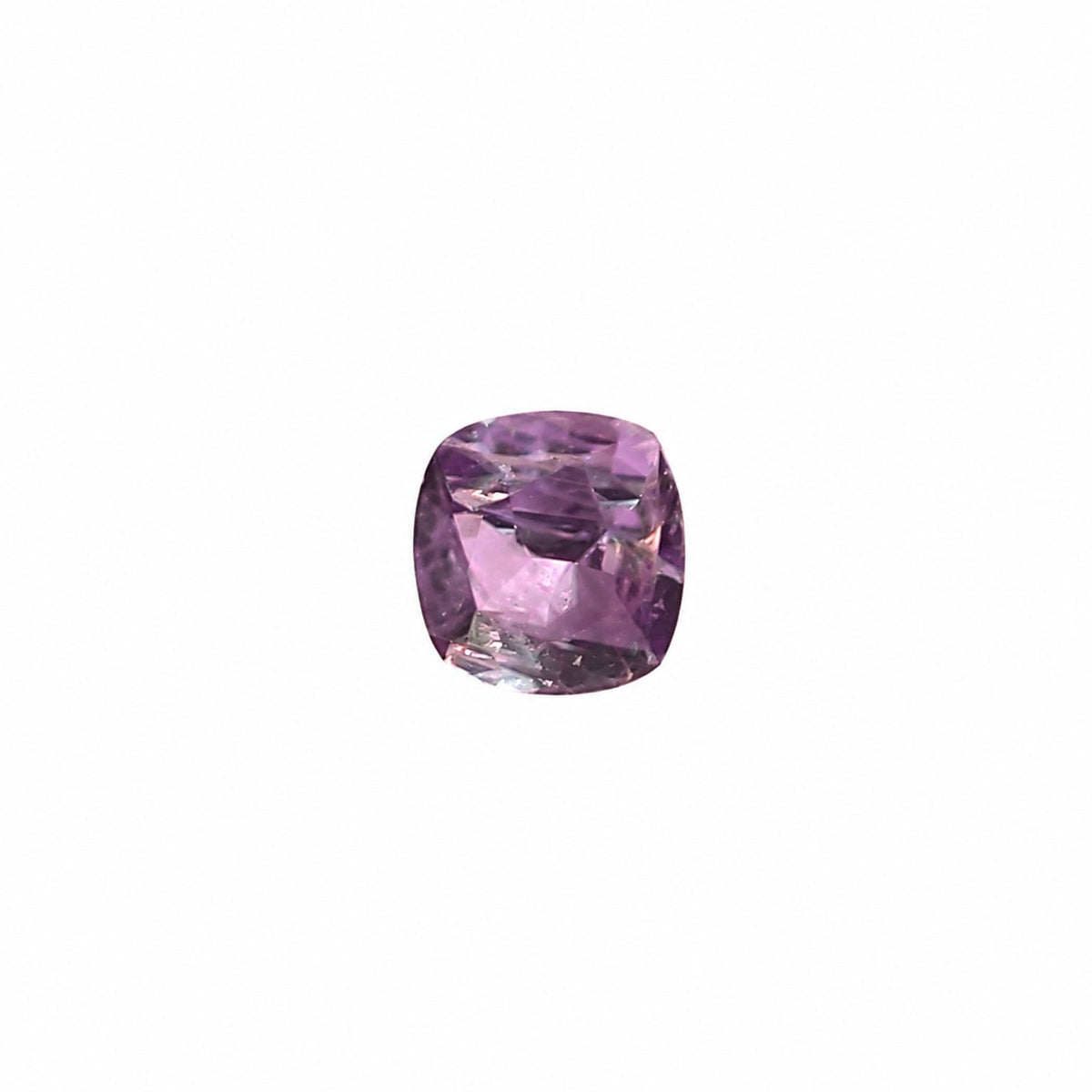 0.39 ct alexandrite under warm light showing its colour change