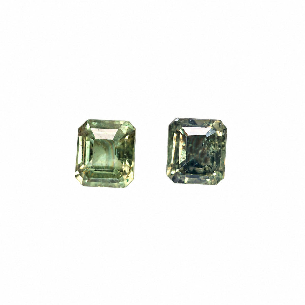 0.96 ct emerald cut alexandrite pair photographed in daylight