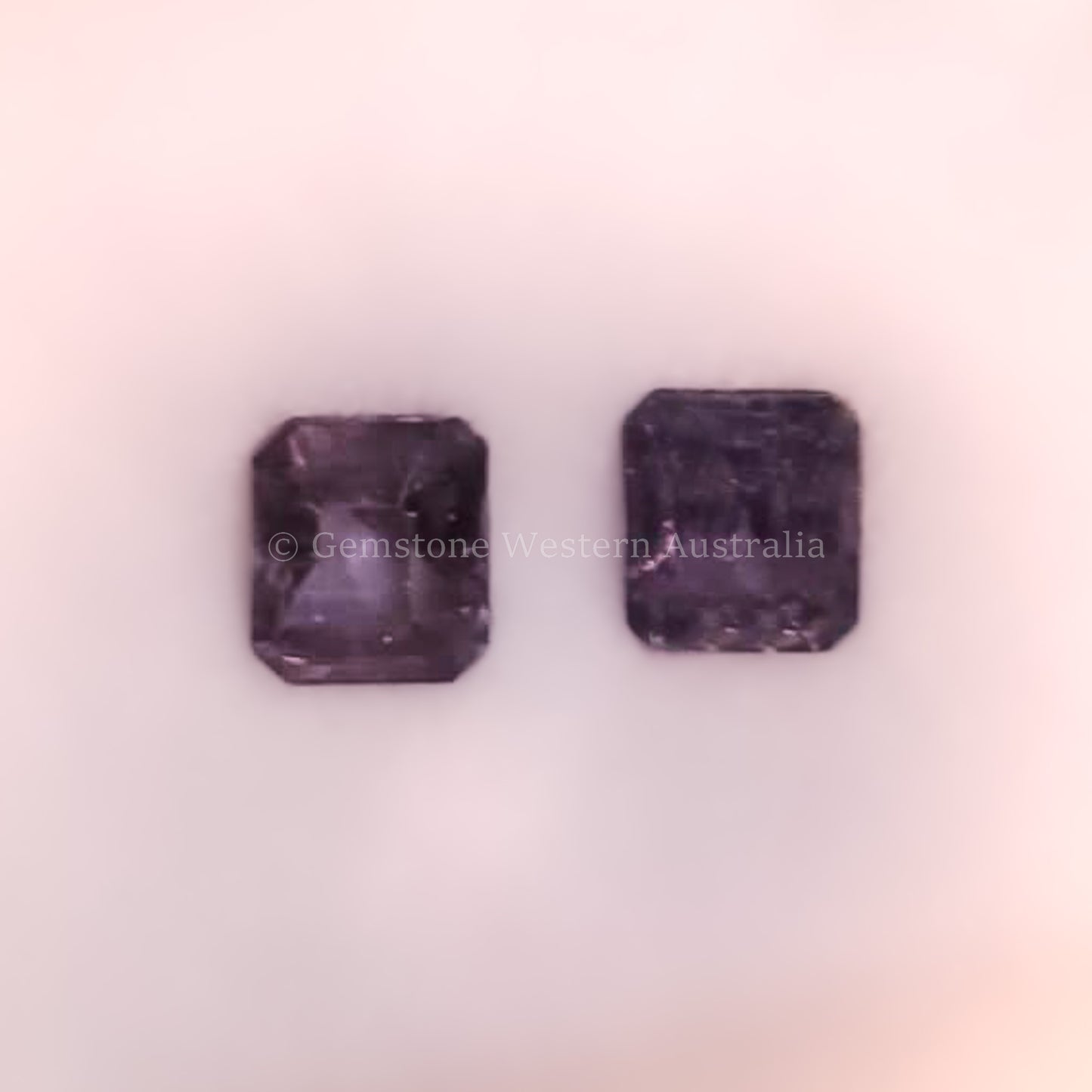 0.96 NATURAL ALEXANDRITE PAIR UNDER CANDLE LIGHT