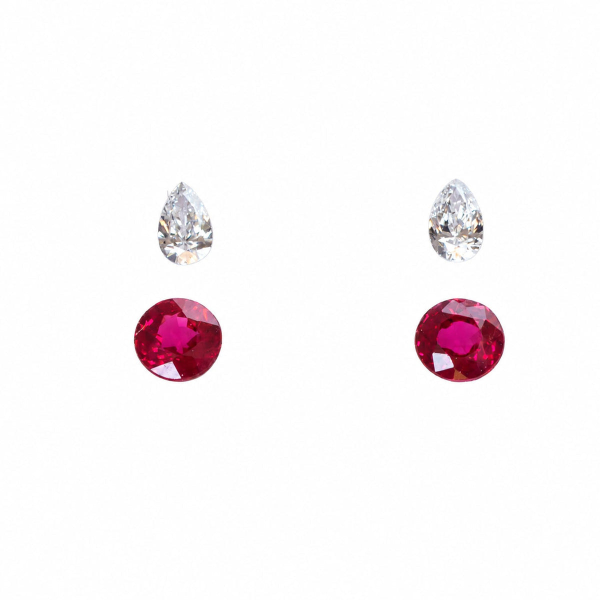 Matched pair of natural unheated rubies totalling 0.9 ct, round cut