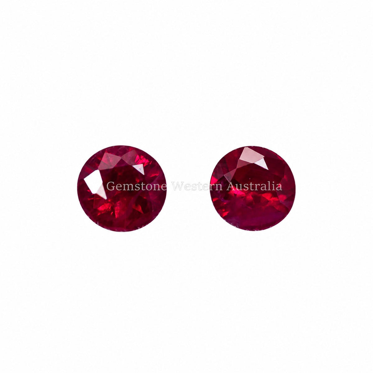Matched pair of natural rubies totalling 0.56 ct, round cut