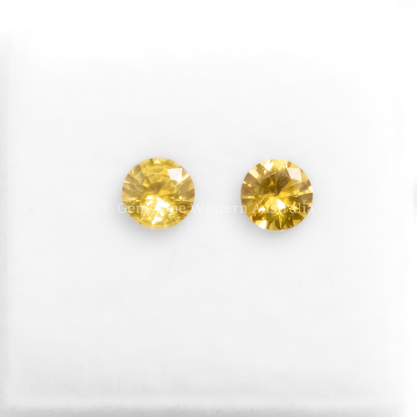 A front view of 0.71CT Natural Unheated Yellow Sapphire Pair in white background.