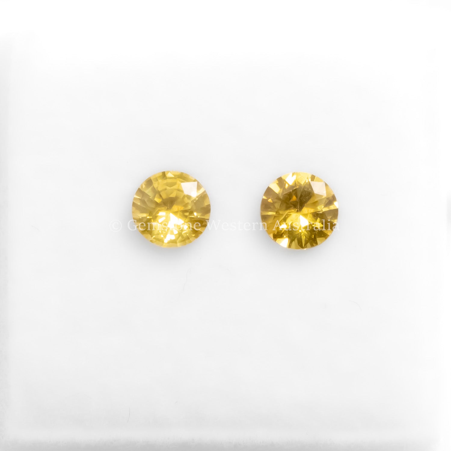 A front view of 0.71CT Natural Unheated Yellow Sapphire Pair in white background.