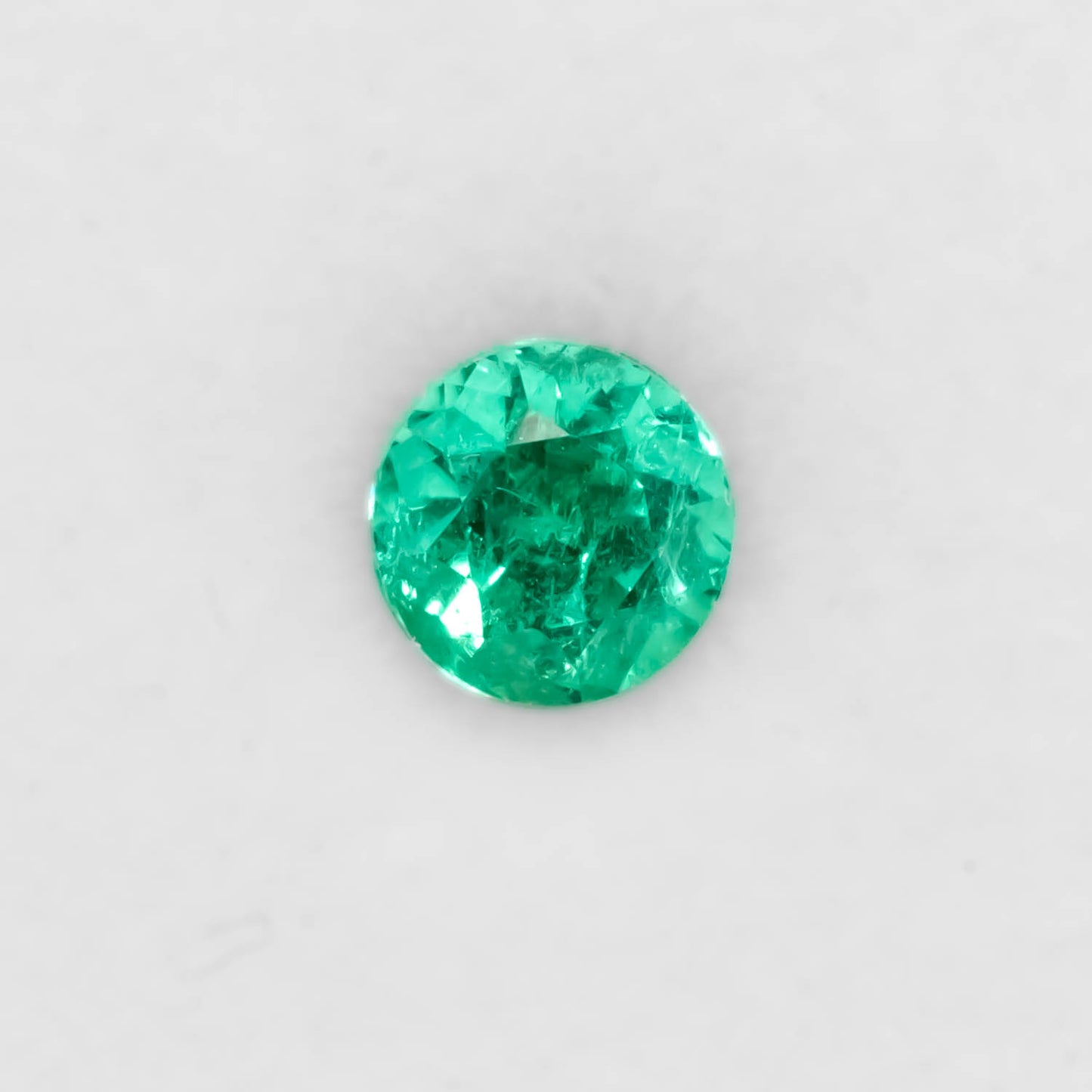 Front view of 1.26CT Natural Colombian Emerald – Emerald Cut Vivid Green Gemstone in white background.